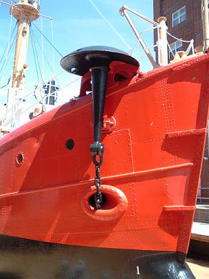 Mushroom anchor held in chock on starboard bow
